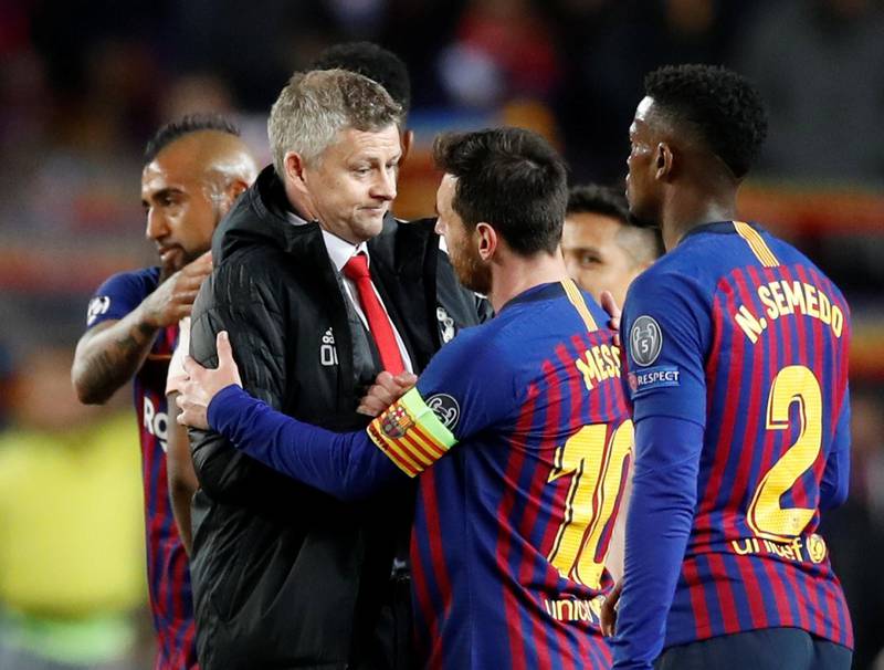 Manchester United manager Ole Gunnar Solskjaer with Barcelona's Lionel Messi after the match. Reuters