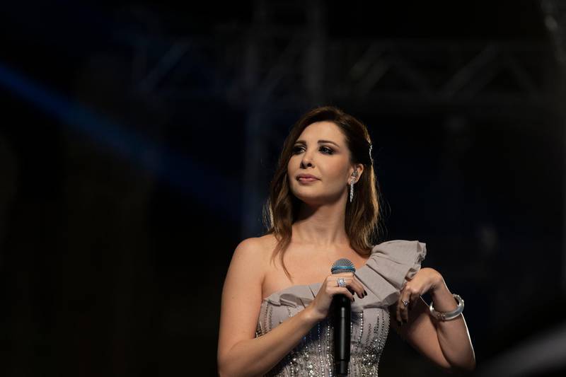 epa07730342 Lebanese singer Nancy Ajram performs during the 2019 Jerash Festival of Culture and Arts at the Jerash archeological site, Jerash, some 46 km North of Amman, Jordan, 20 July 2019. The Jerash festival takes part from 18 to 27 July 2019.  EPA/ANDRE PAIN