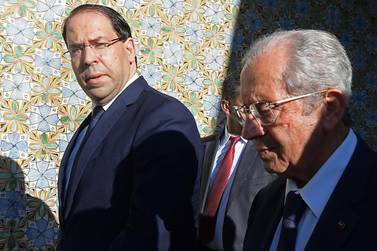 Tunisian Prime Minister Youssef Chahed, left, with former parliament president Mohamed Ennaceur who was sworn in as Interim president on July 25, 2019. AFP