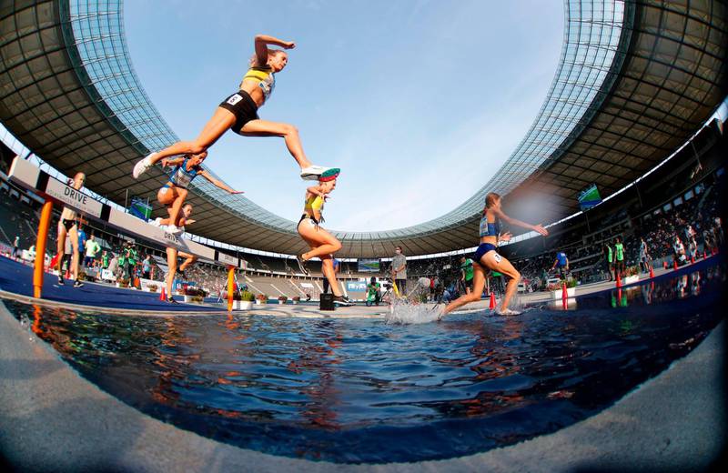 Athletes compete during the women's 3000m steeplechase at the 79th ISTAF international athletics meeting at the Olympic Stadium in Berlin on September 13. AFP