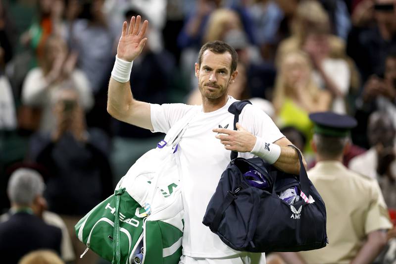 Great Britain's Andy Murray applauds the fans after defeat in the second round match against USA's John Isner on centre court. PA