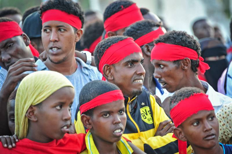 People wear red headbands as a sign of anger as they protest against the deadly bomb attack in Mogadishu. Mohamed Abdiwahab / AFP Photo