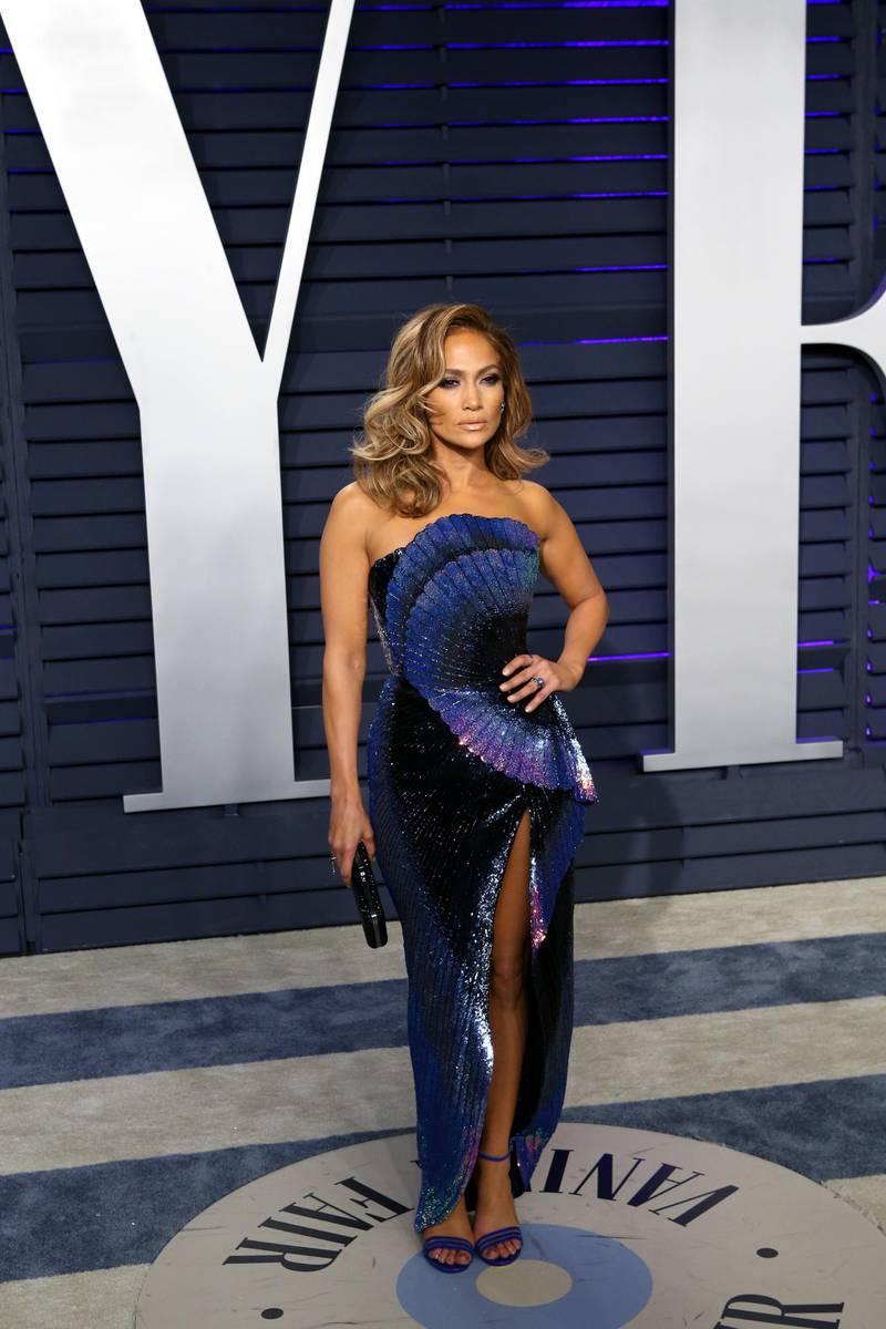 epa07396194 Jennifer Lopez poses at the 2019 Vanity Fair Oscar Party following the 91th annual Academy Awards ceremony, in Beverly Hills, California, USA, 24 February 2019. Blue and navy dress by Zuhair Murad. The Oscars are presented for outstanding individual or collective efforts in 24 categories in filmmaking.  EPA-EFE/NINA PROMMER