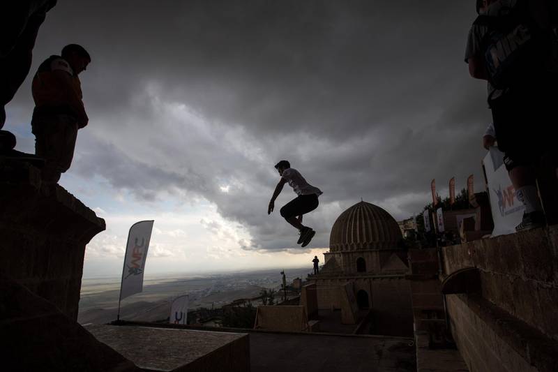 Competitors warm up ahead of the start of the freestyle category during the second round of the World Parkour Championships in Mardin, Turkey. Chris McGrath / Getty Images