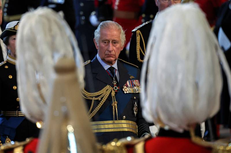 King Charles III behind the coffin of Queen Elizabeth II as it is brought into Westminster Hall, London, where it will lie in state before her funeral on Monday. PA