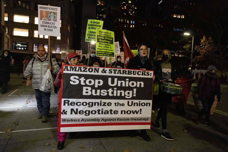 In this file photo taken on November 26, 2021, people march during a protest in support of Amazon and Starbucks workers in New York City. AFP