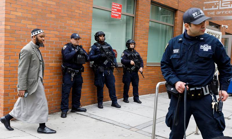 epa07440470 New York City police officers, including officers from the department's Counterterrorism Unit, provide security at the Islamic Cultural Center of New York as people arrive for Friday prayers in New York, New York, USA, 15 March 2019. Security in New York, and at sites around the world, was heightened following what was described as terrorist attacks at two mosques in New Zealand where 49 people were killed by a gunman and 20 more injured and in critical conditions.  EPA/JUSTIN LANE