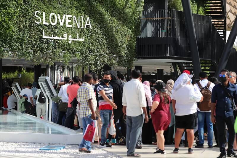Visitors queue outside the verdant Slovenia pavilion