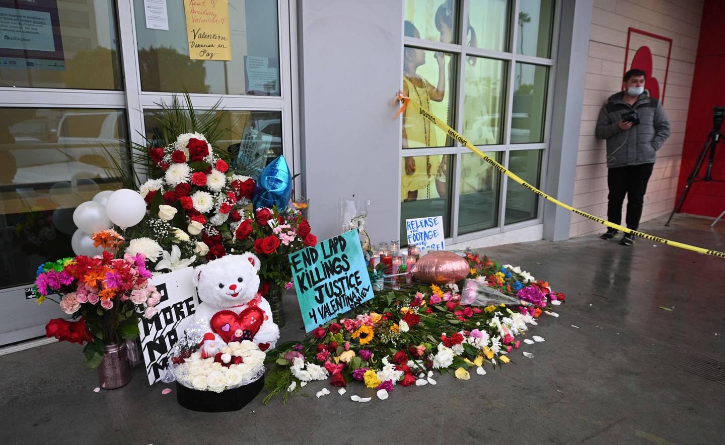 Flowers are left at a makeshift memorial for the teenage girl who was killed by a police stray bullet at a Burlington store in North Hollywood, California. AFP