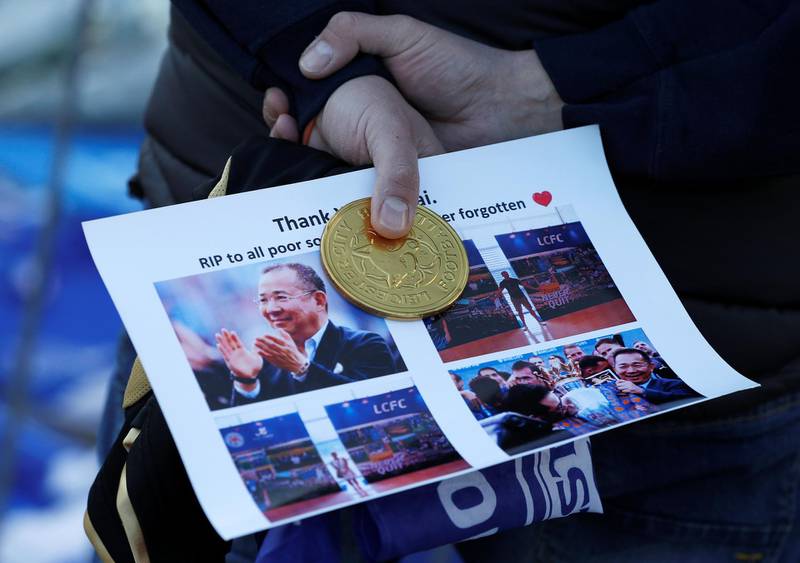 A man holds a tribute. Reuters