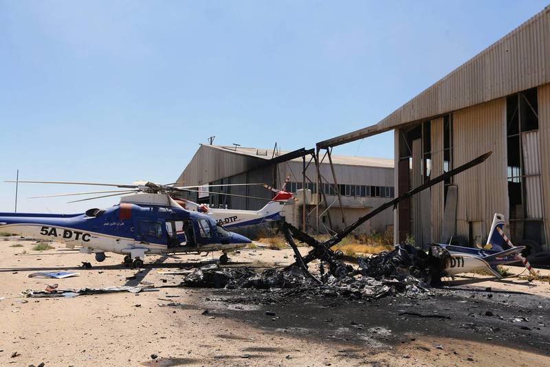 ‘The airport was attacked this morning with mortar rounds, rockets and tank fire,’ an airport security official said. Seen here is a picture taken on July 16, 2014, shows the remains of a burnt airplane at the airport. Mahmud Turkia/AFP Photo
