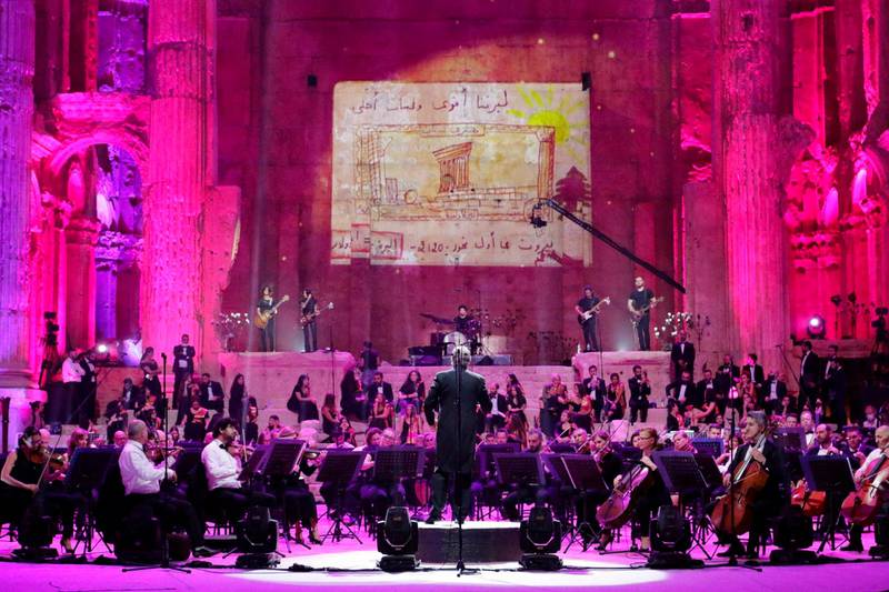 Maestro Harout Fazlian conducts rehearsals ahead of the Sound of Resilience concert inside the Temple of Bacchus at the historic site of Baalbek in Lebanon's eastern Bekaa Valley. AFP