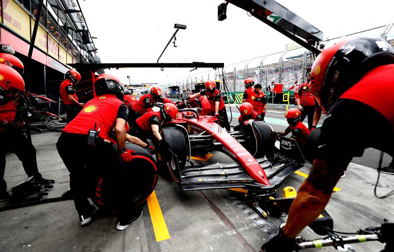 Pit crew work on Ferrari driver Charles Leclerc's car at the Albert Park Circuit in Melbourne. AFP