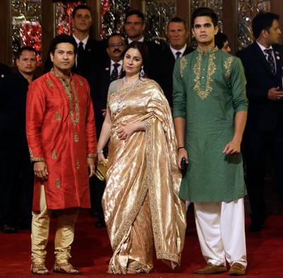 Formet Indian cricketer Sachin Tendulkar,  his wife Anjali and son Arjun arrive. AP Photo