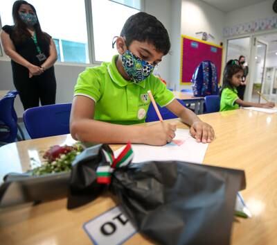 Pupils from Al Mamoura Academy in Abu Dhabi on their first day of classes after the summer break. Victor Besa / The National
