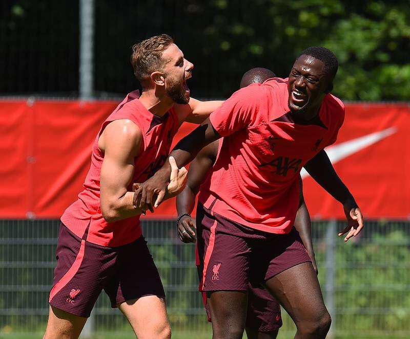 Jordan Henderson and Ibrahima Konate enjoy a joke during Liverpool's pre-season training session.