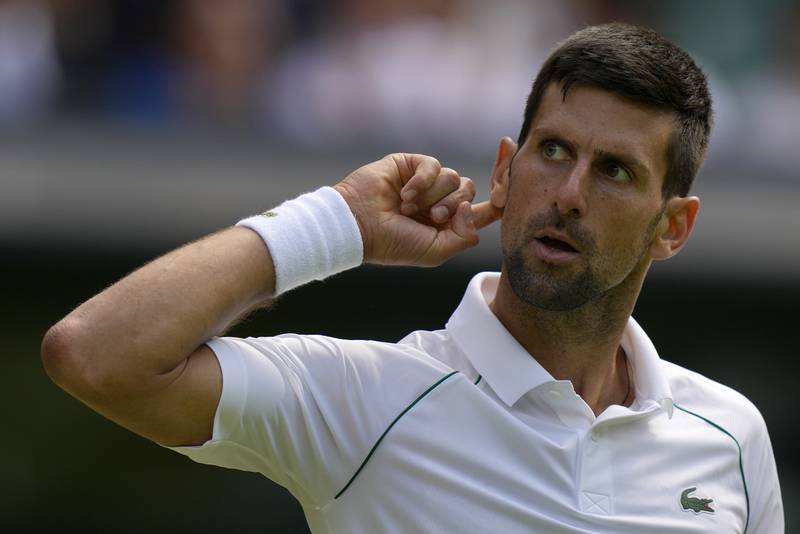 Novak Djokovic signals to the crowd during his match against Jannik Sinner. AP 