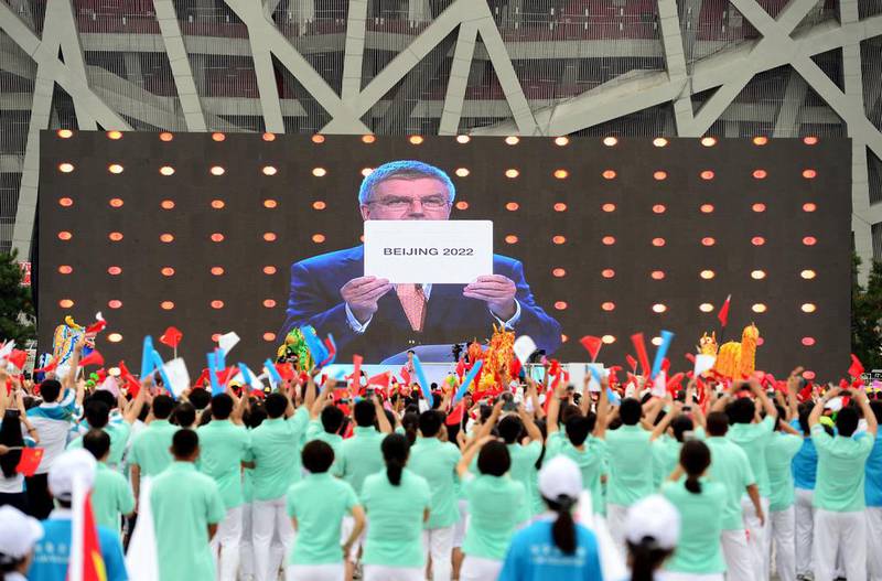 People cheer as they watch on a screen the IOC announcing Beijing as the winner city for the 2022 Winter Olympics bid. Stringer / Reuters