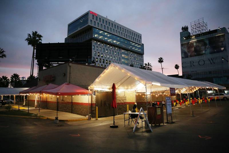 A tented area which had been used for outdoor restaurant dining at Denny's stands empty on the first day of new stay-at-home orders on December 7, 2020 in Los Angeles, California.  AFP