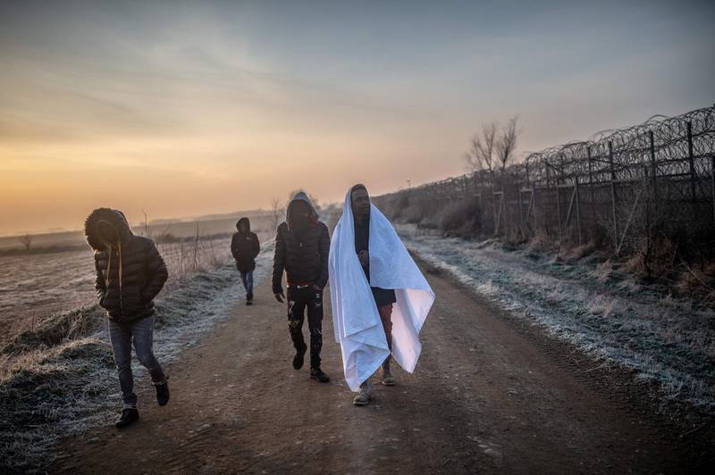 Migrants walk towards the Greek border in Pazarkule, in the Edirne district. Thousands of migrants stuck on the Turkey-Greece border clashed with Greek police.  AFP