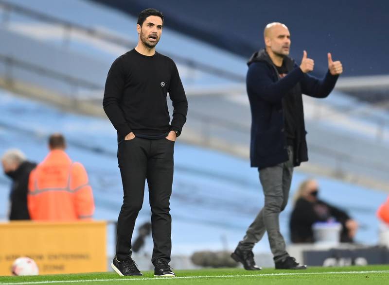 Manchester City manager Pep Guardiola, right, and his Arsenal counterpart Mikel Arteta. EPA