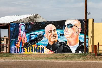 Mural displaying Jeff Bezos and his brother Mark Bezos, in Van Horn, Texas, where Blue Origin rocket launches take place. Reuters