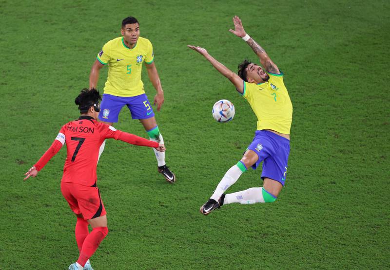 Brazil's Lucas Paqueta in action with South Korea's Son Heung-min. Reuters