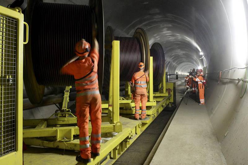 Construction workers working in the Gotthard Base Tunnel. The excavation work has taken more than 15 years and cost about US$12.7 billion. Karl Mathis / EPA