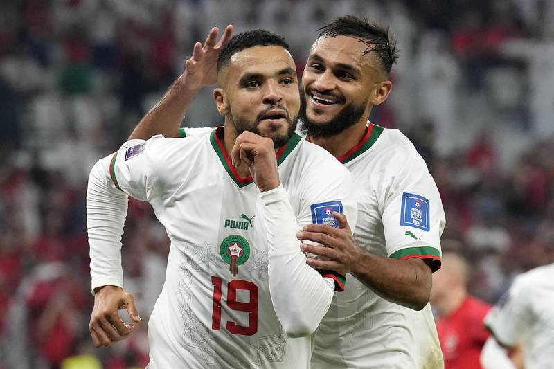 Canada 1-2 Morocco: Morocco's Youssef En-Nesyri, left, celebrates with Sofiane Boufal after scoring his side's second goal at Al Thumama Stadium on December 1, 2022. The African nation secured their place in the World Cup last 16 for first time since 1986. AP