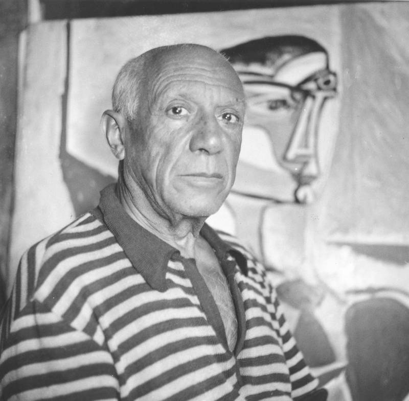 Spanish artist Pablo Picasso (1881 - 1973) in front of one of his paintings at home in Cannes.   (Photo by George Stroud/Getty Images)