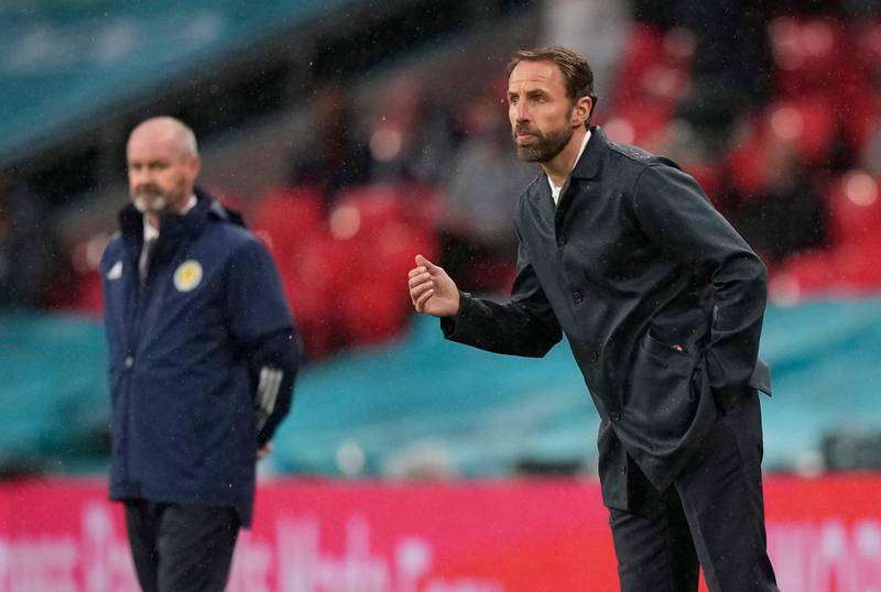 England manager Gareth Southgate with his Scotland counterpart Steve Clarke in the background. Reuters