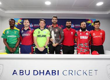 Left to right at T20 World Cup Qualifier captains' press conference on Sunday: Ademola Onikoyi of Nigeria, Jersey's Charlie Perchard, Gary Wilson of Ireland, UAE's Ahmed Raza, Navneet Dhaliwal of Canada, Oman's Zeeshan Maqsood, and Aizaz Khan of Hong Kong. Chris Whiteoak / The National