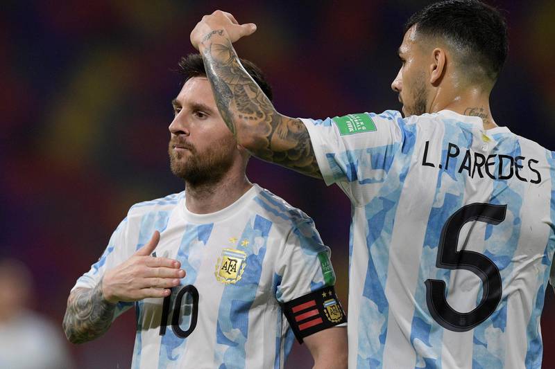 Lionel Messi celebrates with Leandro Paredes after scoring against Chile. EPA