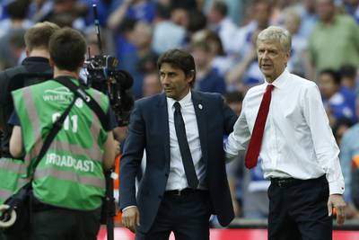 Arsenal's French manager Arsene Wenger (R) and Chelsea's Italian head coach Antonio Conte speak at the final whistle in the English FA Cup final football match between Arsenal and Chelsea at Wembley stadium in London on May 27, 2017.
Aaron Ramsey scored a 79th-minute header to earn Arsenal a stunning 2-1 win over Double-chasing Chelsea on Saturday and deliver embattled manager Arsene Wenger a record seventh FA Cup. / AFP PHOTO / Ian KINGTON / NOT FOR MARKETING OR ADVERTISING USE / RESTRICTED TO EDITORIAL USE