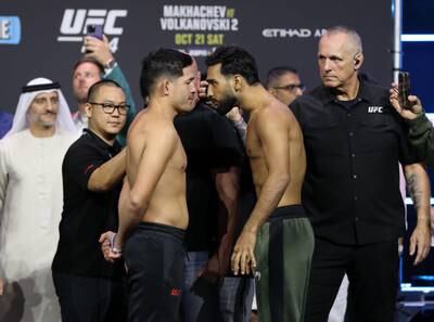UFC Lightweight Anshul Jubli, right, and Mike Breeden face off at the ceremonial weigh in before their fight at UFC 294 in Abu Dhabi. Chris Whiteoak / The National