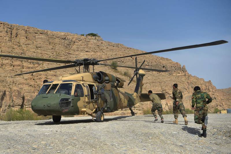 Afghan soldiers unload supplies from an Afghan Air Force Black Hawk helicopter at the Kajaki Dam in Kajaki, Helmand Province. Afghan legislators have voiced concerns about the ability of the military to withstand a Taliban offensive.