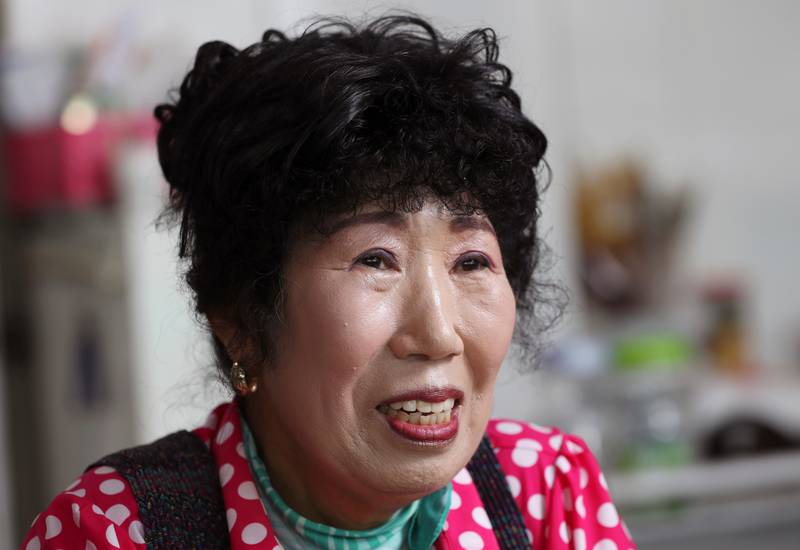 In this July 4, 2017 photo, South Korea's YouTube star, Park Makrye, 70, speaks during an interview at her restaurant in Yongin, South Korea. Park's videos are all about showing off her wrinkles and her elderly life in the raw. Young South Koreans find her so funny and adorable that big companies like Samsung Electronics and Lotte are banking on her popularity. But despite her new life as a celebrity, she still gets up before dawn to run her diner. (AP Photo/Lee Jin-man)
