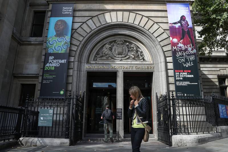Pedestrians walk past the entrance to the National Portrait Gallery in central London on August 24, 2018. (Photo by Daniel LEAL-OLIVAS / AFP)