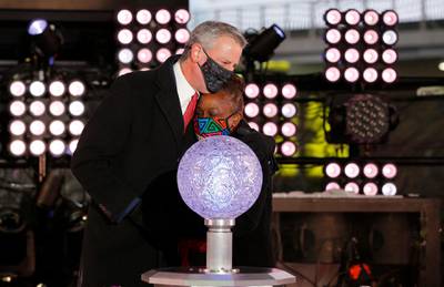 Mayor Bill De Blasio hugs his wife Chirlane McCray after dropping the ball on New Years Day in Times Square in New York City, U.S. Reuters