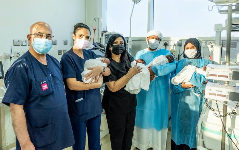 Roaya Tawakol, far right, with her husband, medical team and four babies, all delivered by caesarean at 29 weeks. Photo: Medcare Women & Children Hospital