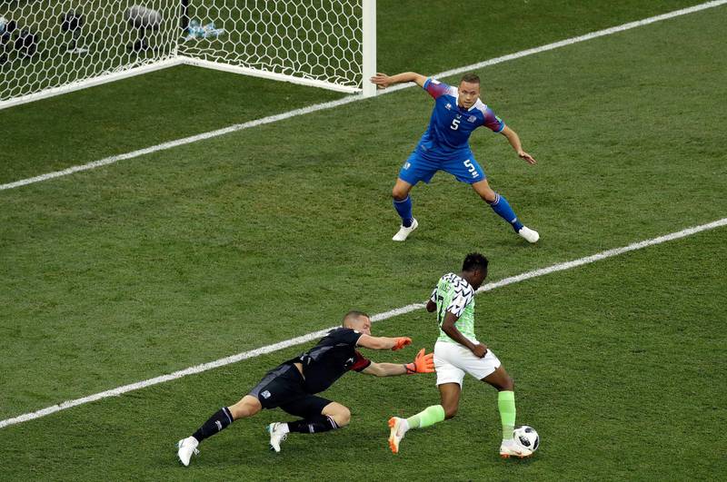 Ahmed Musa, right, dribbles past Iceland goalkeeper Hannes Halldorsson, left, to score Nigeria's second goal. Themba Hadebe / AP Photo