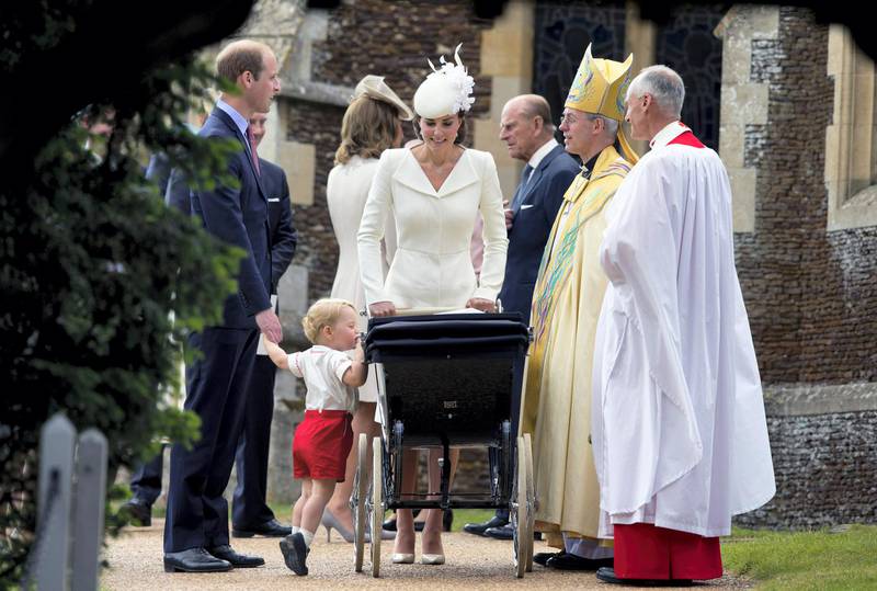 KING'S LYNN, ENGLAND - JULY 05:  Catherine, Duchess of Cambridge, Prince William, Duke of Cambridge, Princess Charlotte of Cambridge and Prince George of Cambridge speak with Archbishop of Canterbury Justin Welby, as they leave the Church of St Mary Magdalene on the Sandringham Estate after the Christening of Princess Charlotte of Cambridge on July 5, 2015 in King's Lynn, England.  (Photo by Matt Dunham - WPA Pool/Getty Images)