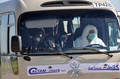 Algerians, Libyans and Mauritanians on a transport bus following their evacuation from China amid the coronavirus epidemic at the Houari Boumediene Airport in Algiers, Algeria.  EPA