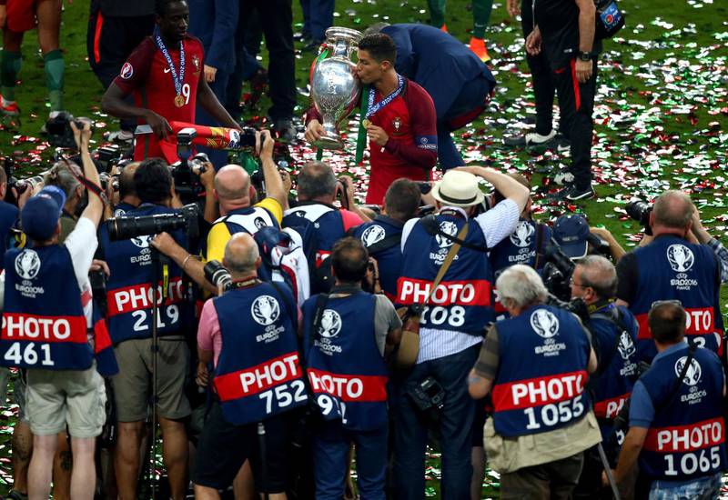 PARIS, FRANCE - JULY 10:  Cristiano Ronaldo of Portugal kisses the Henri Delaunay trophy to celebrate after their 1-0 win against France in the UEFA EURO 2016 Final match between Portugal and France at Stade de France on July 10, 2016 in Paris, France.  (Photo by Alex Livesey/Getty Images)