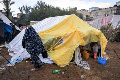 Palestinians taking shelter. AFP