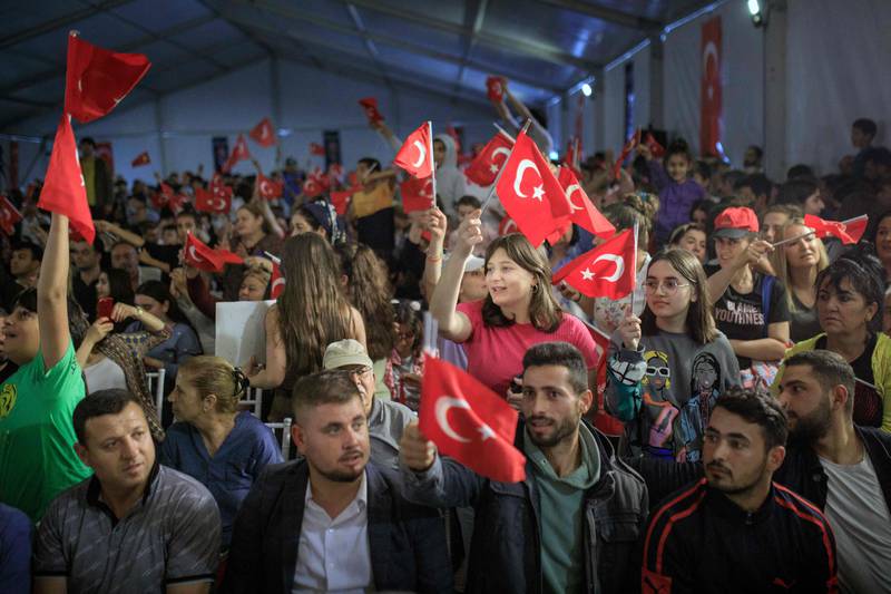 Kemal Kilicdaroglu supporters wave national flags at a campaign rally in Antakya, Turkey. AFP