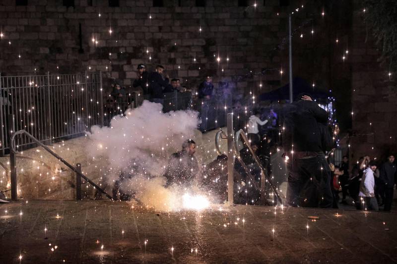 An anti-riot flare explodes outside the Damascus Gate. AFP