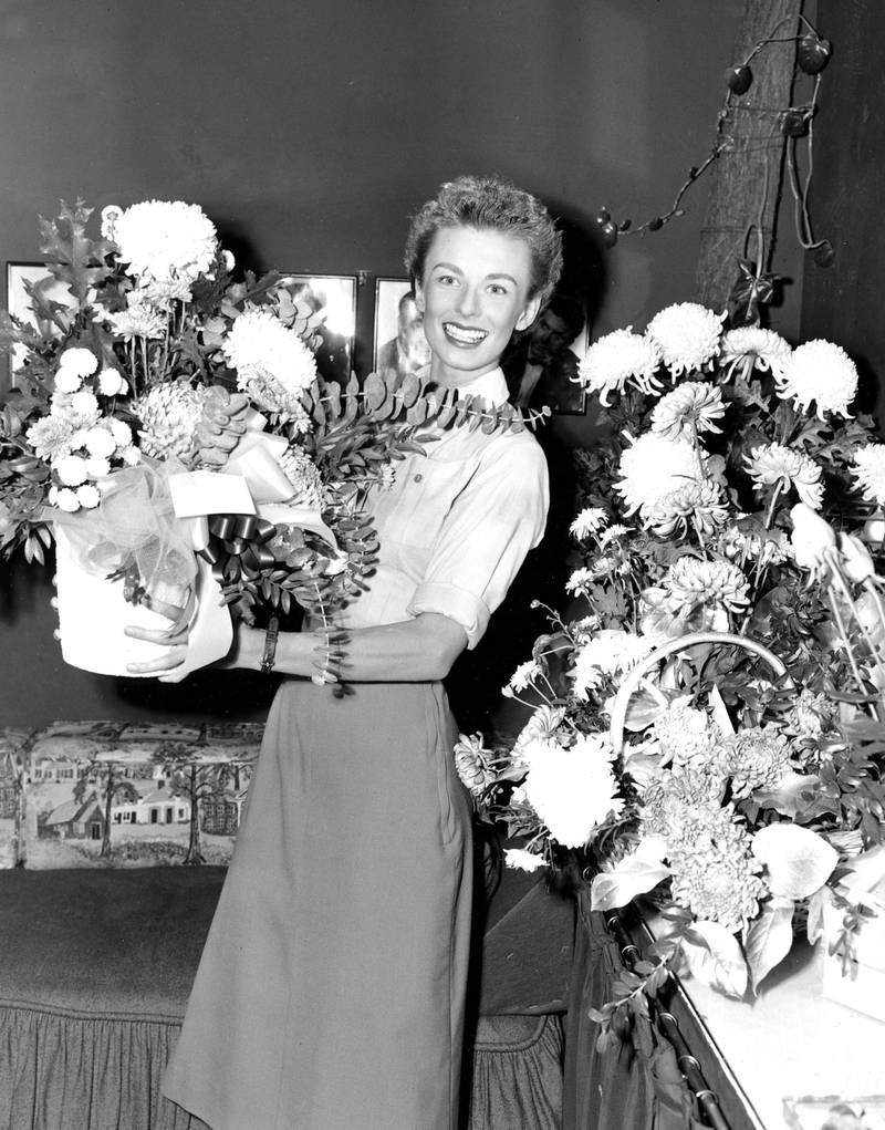 Cloris Leachman in her dressing room at the Majestic Theatre with the flowers she received for playing the lead in 'South Pacific' on Broadway in New York, 1952. AP