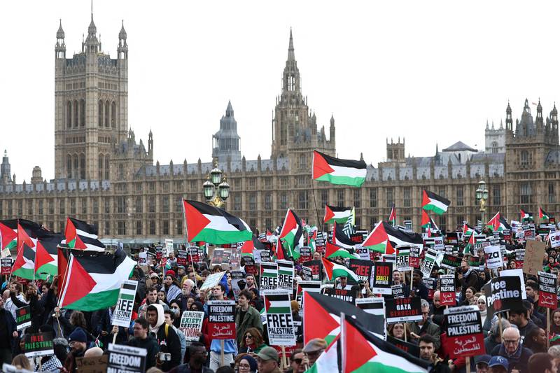 Protesters waving Palestinian flags crossed Westminster Bridge during their march to demand a ceasefire in Gaza. AFP 