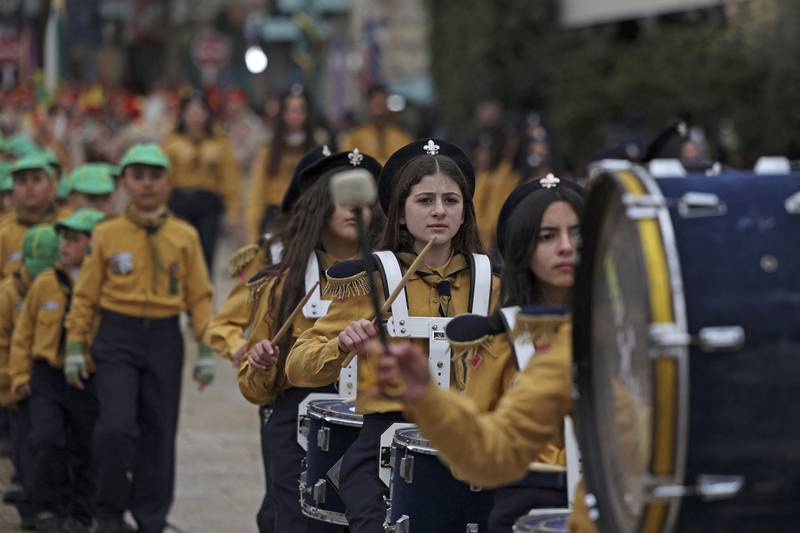 Palestinian scouts parade outside the Church of the Nativity. AFP